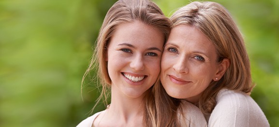Mother Looking Like Daughter After Skin Rejuvenation Lumenis Treatment a young woman and a mature woman smiling