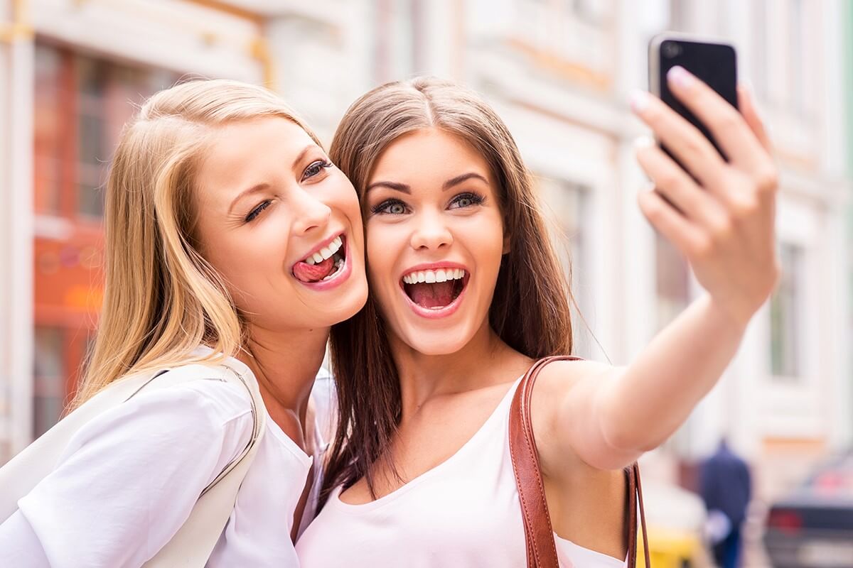 aesthetic-trends-image-1200x800-web two women smiling while taking a selfie