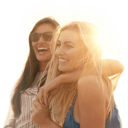 Women Happy After Lumines Skin Resurfacing Treatment two women hugging each other and smiling