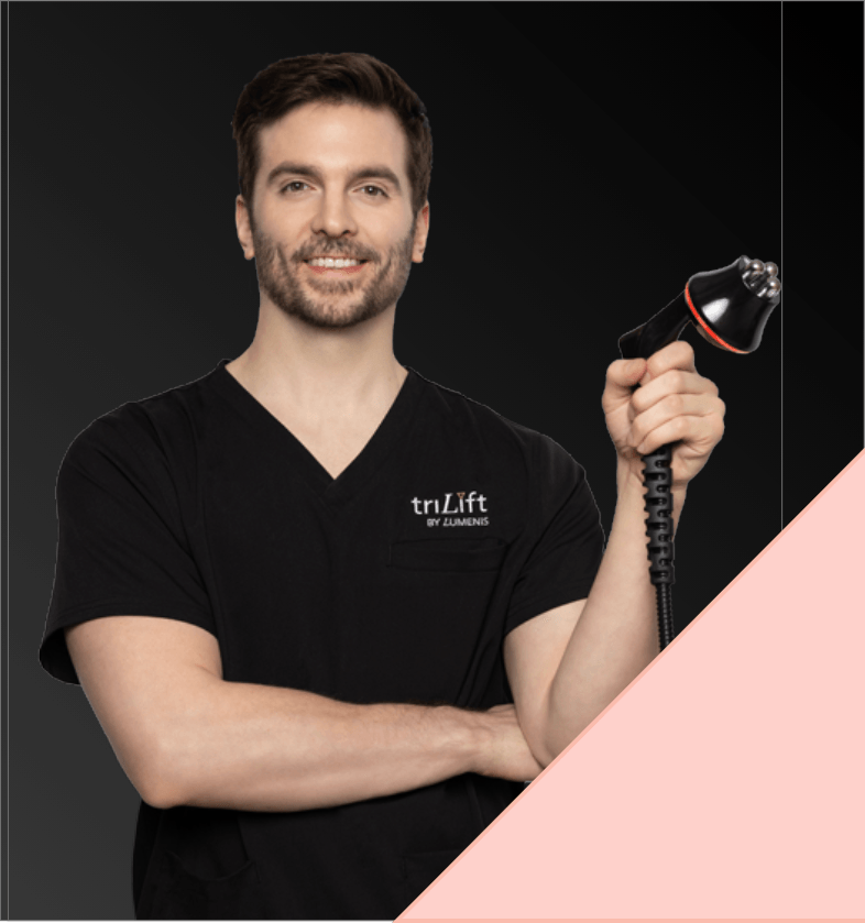 TriLift_Clinic_1 A man holding trilift's hand piece